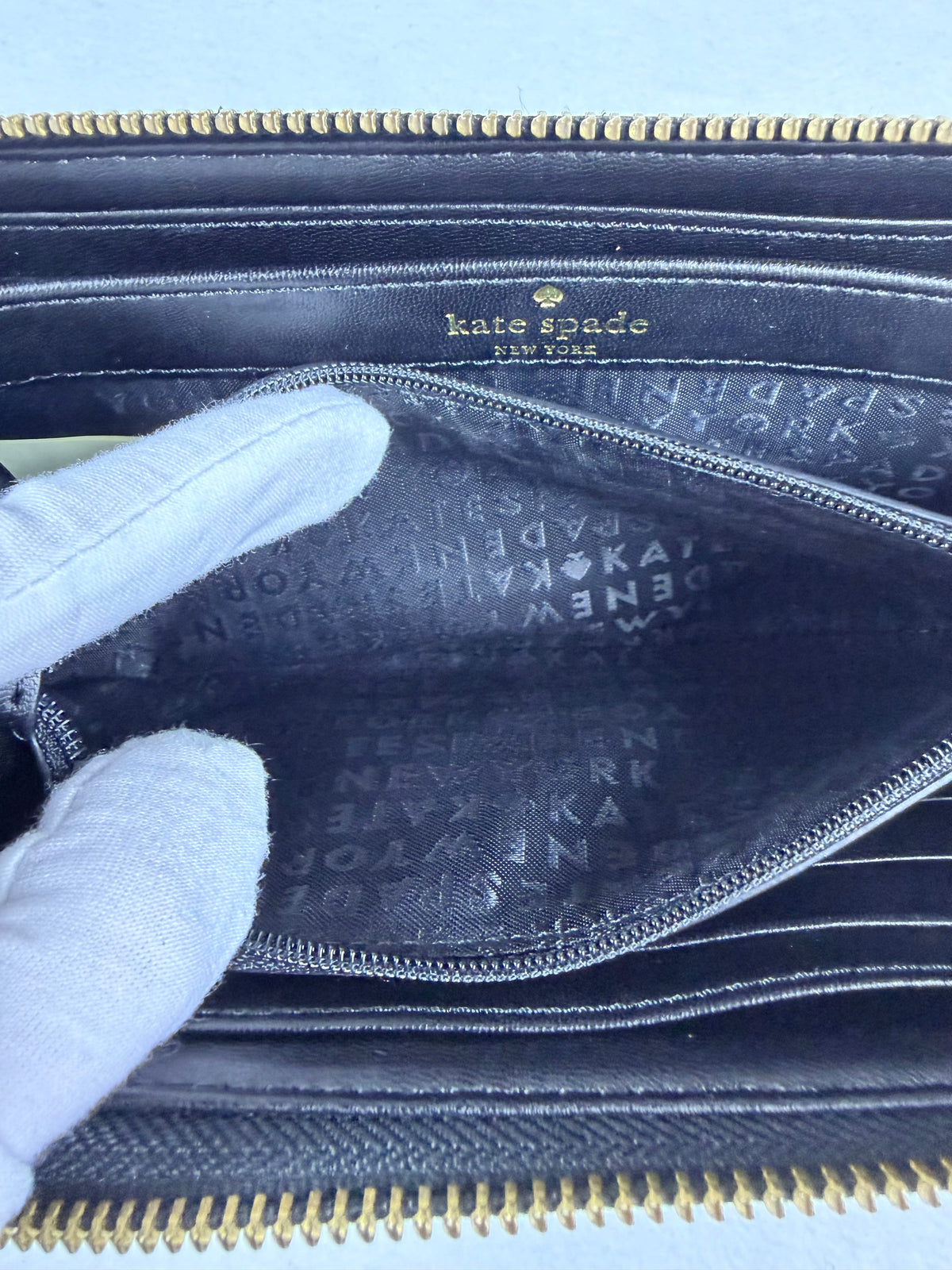 Kate Spade Pebbled Black Leather Zip-Around Wallet with Gold Plaque