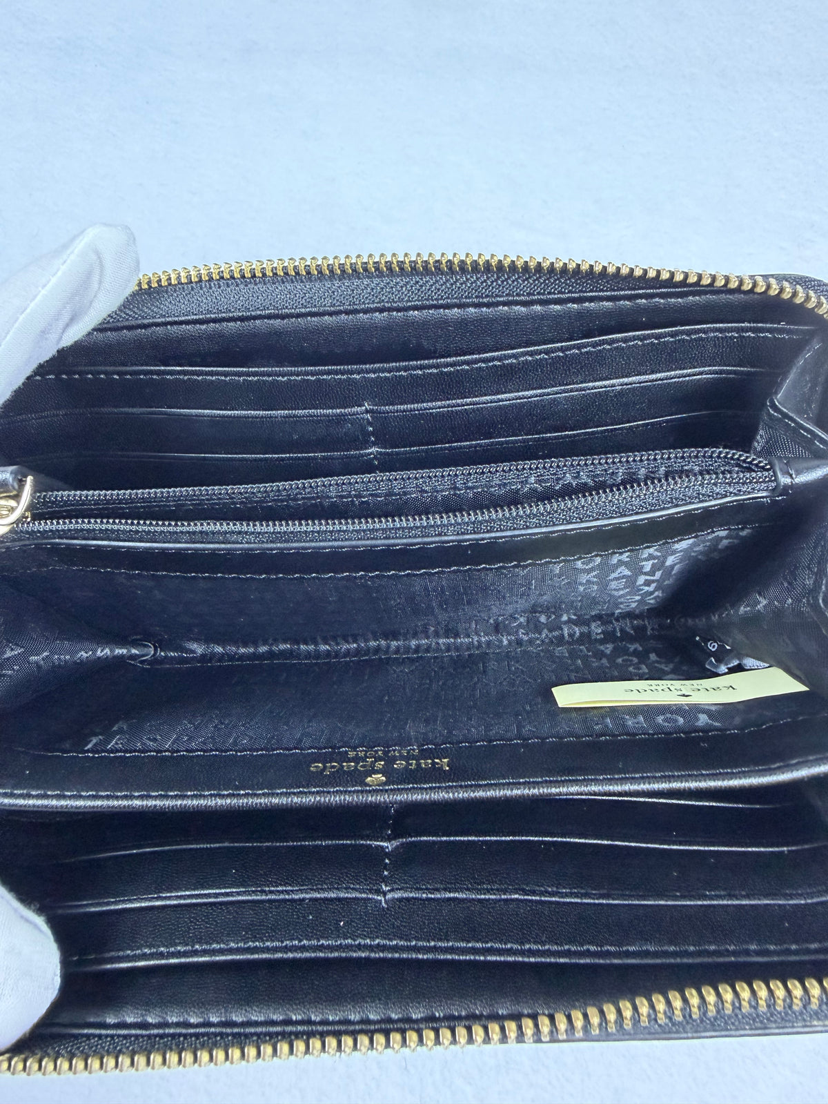 Kate Spade Pebbled Black Leather Zip-Around Wallet with Gold Plaque