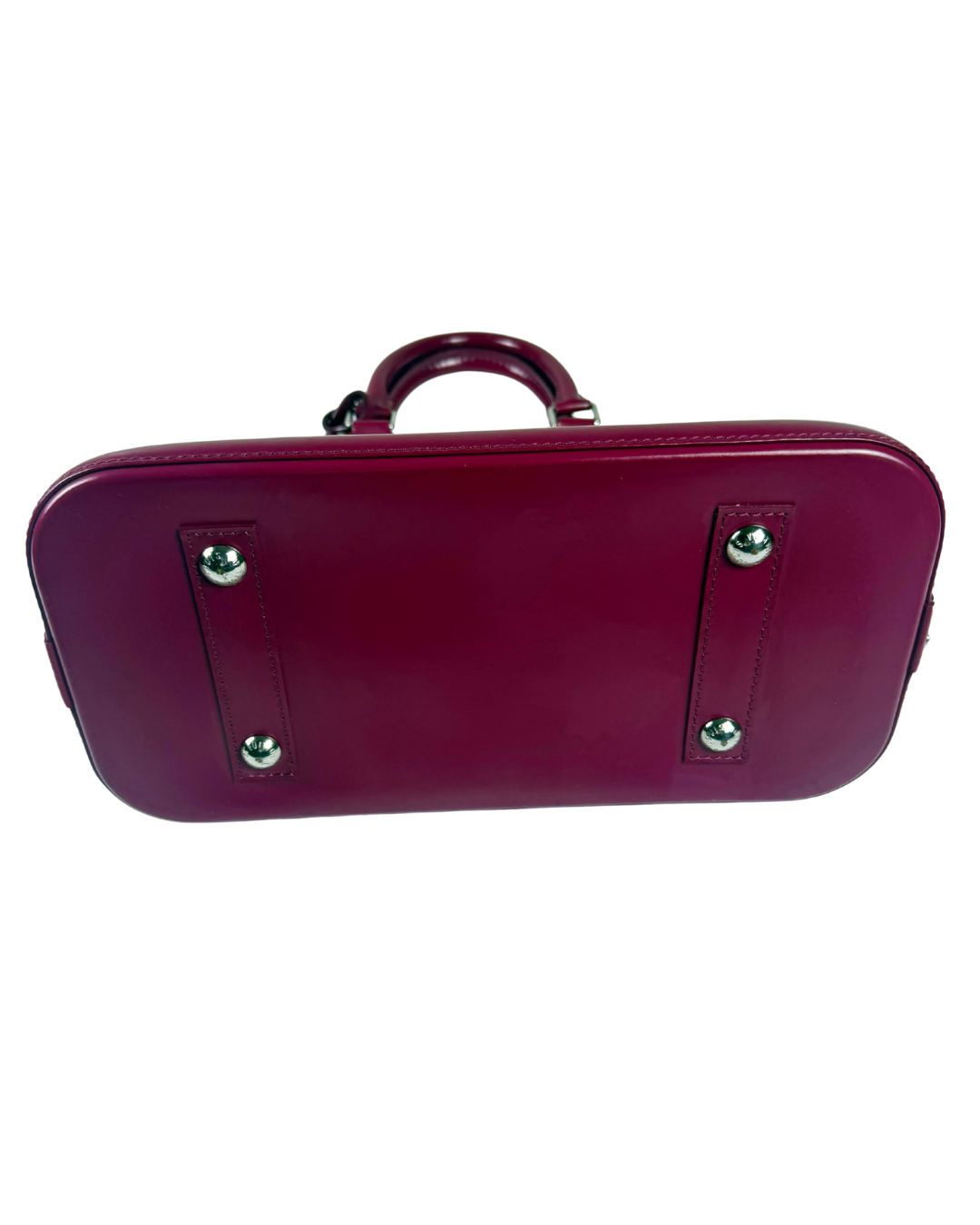 A burgundy leather hard-shell handbag with a top handle, shown from the bottom against a plain white background.