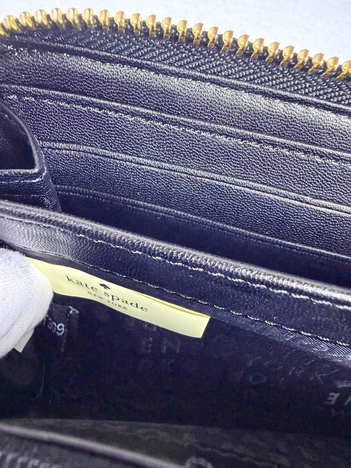 Kate Spade Pebbled Black Leather Zip-Around Wallet with Gold Plaque